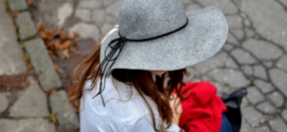 grey hat with red coat